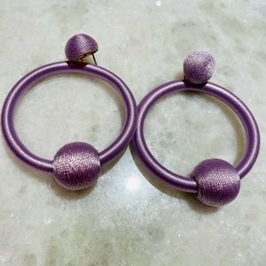 Light purple hoop style statement earrings